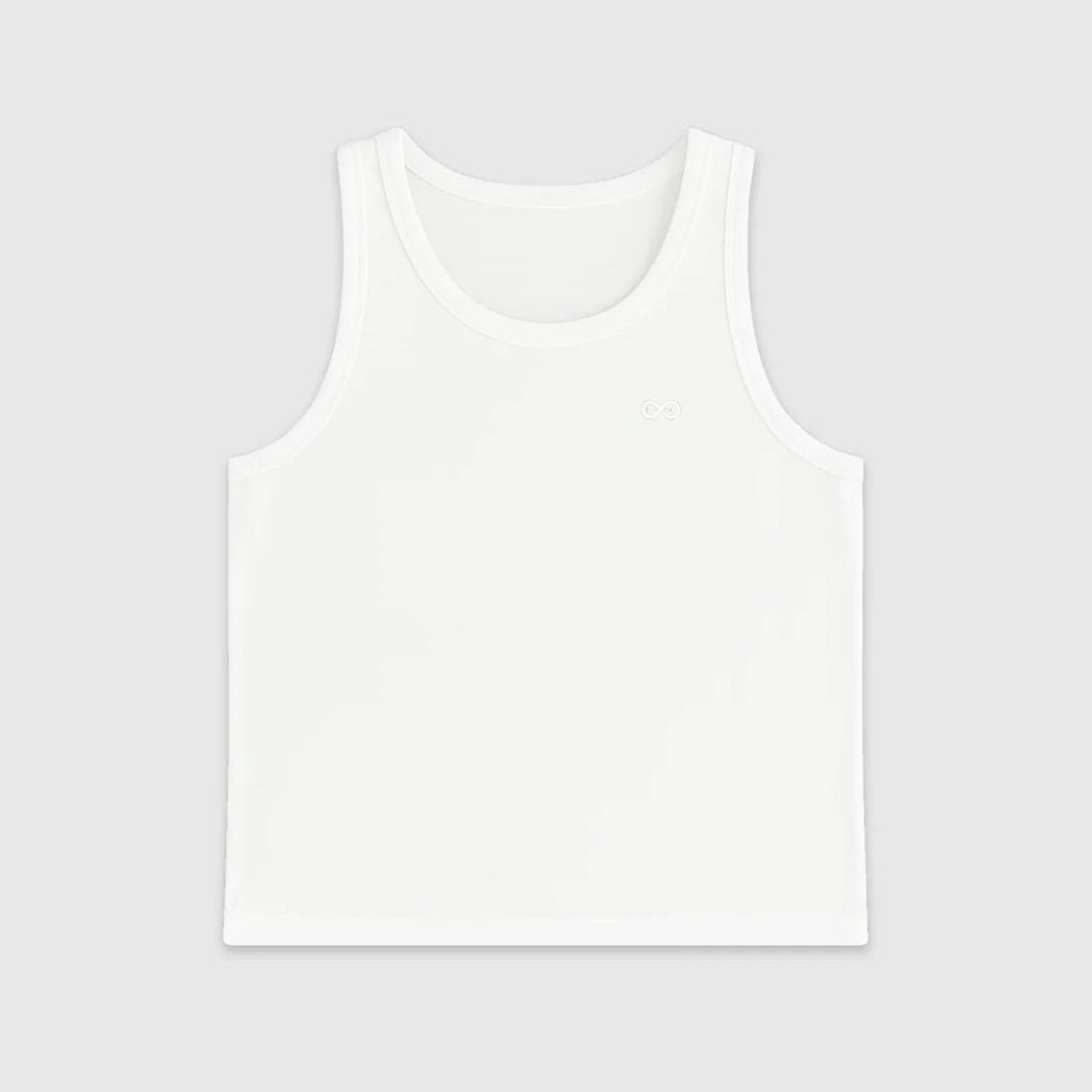 A white crop tank top for kids, displayed against a plain background.