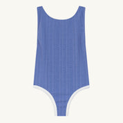 Blue swimsuit with white trim on a white background