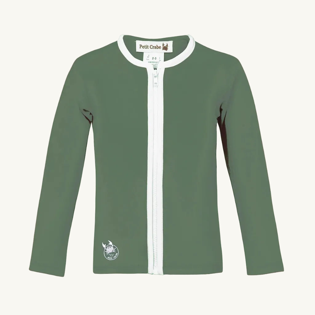 Green long-sleeve shirt with white zipper on a white background
