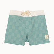 Green checkered shorts with white accents on a white background