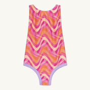 Colorful one-piece swimsuit with wave pattern on a white background