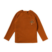 Orange long-sleeve shirt with a palm tree design on a white background