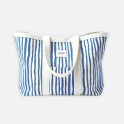Blue and white striped tote bag on a light gray background