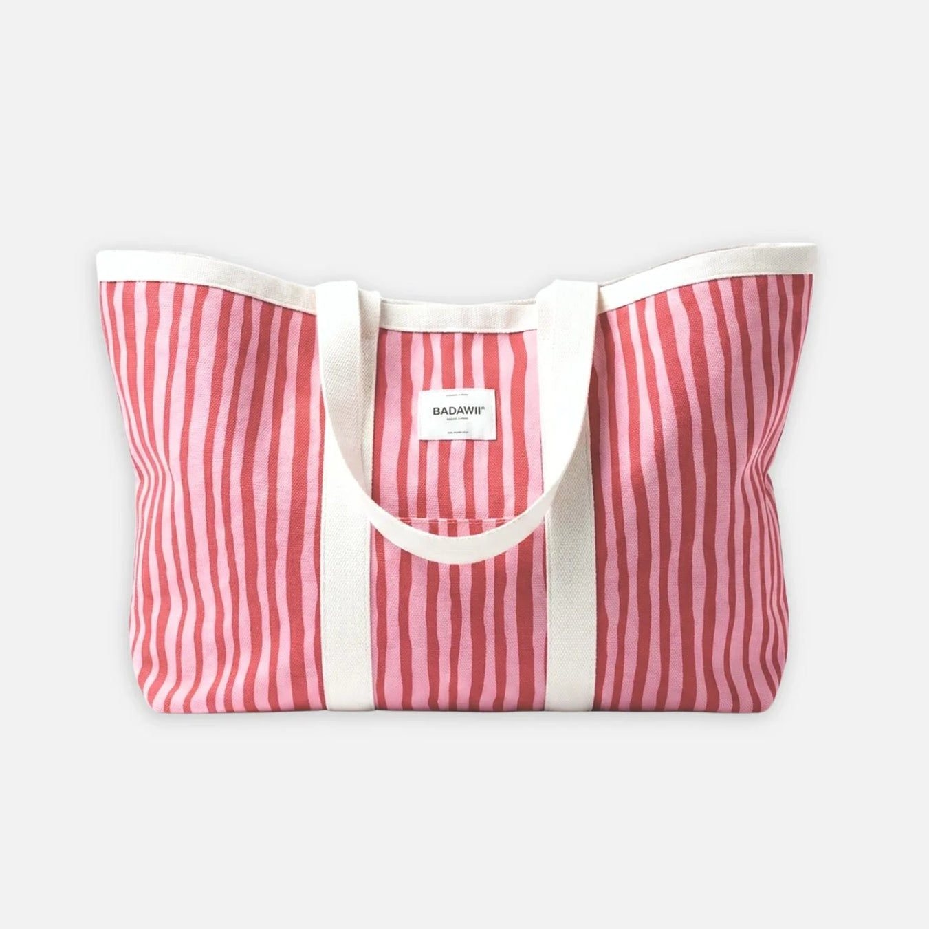 Red and white striped tote bag on a light gray background