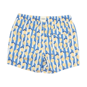 Blue swim shorts with yellow abstract pattern on a white background